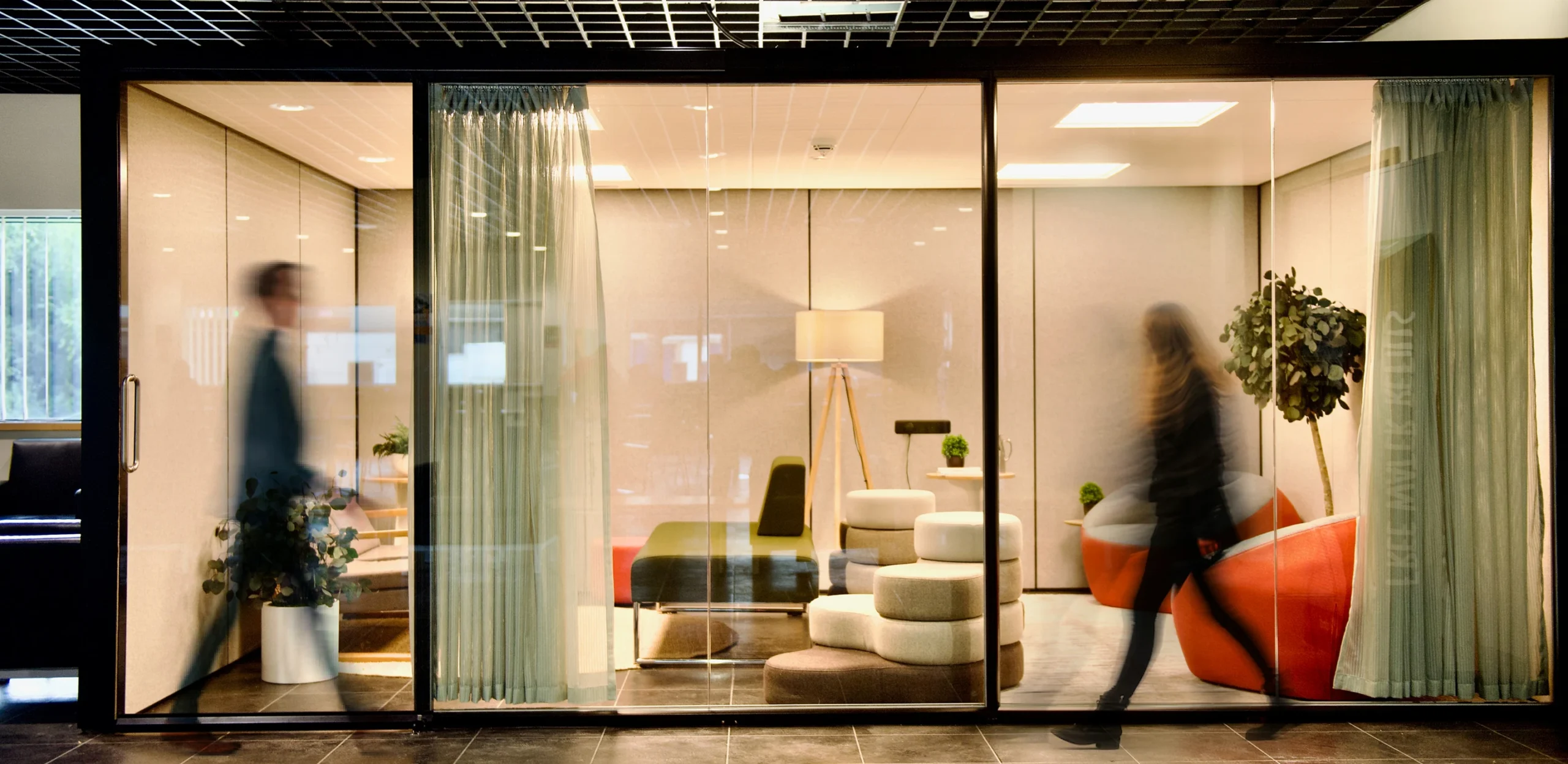 People Walking in Front of East On Designed Room